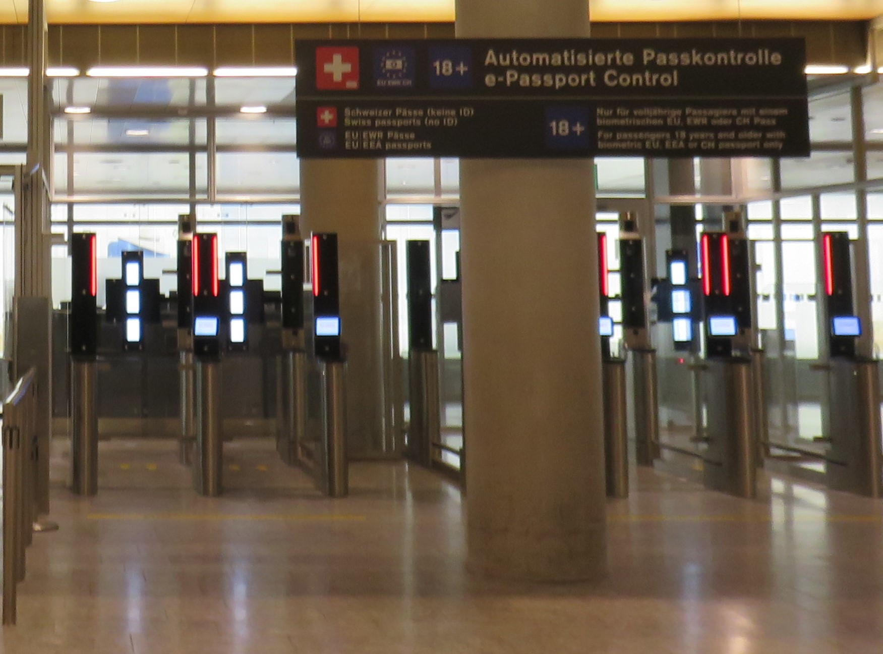 Automated e-Passport control gates at Zurich Airport, with a sign in German and English